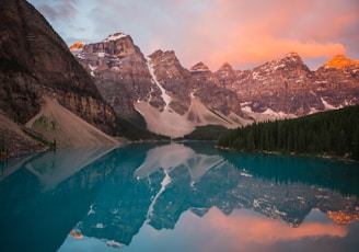 mountain reflection on body of water