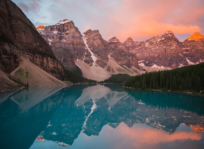 mountain reflection on body of water