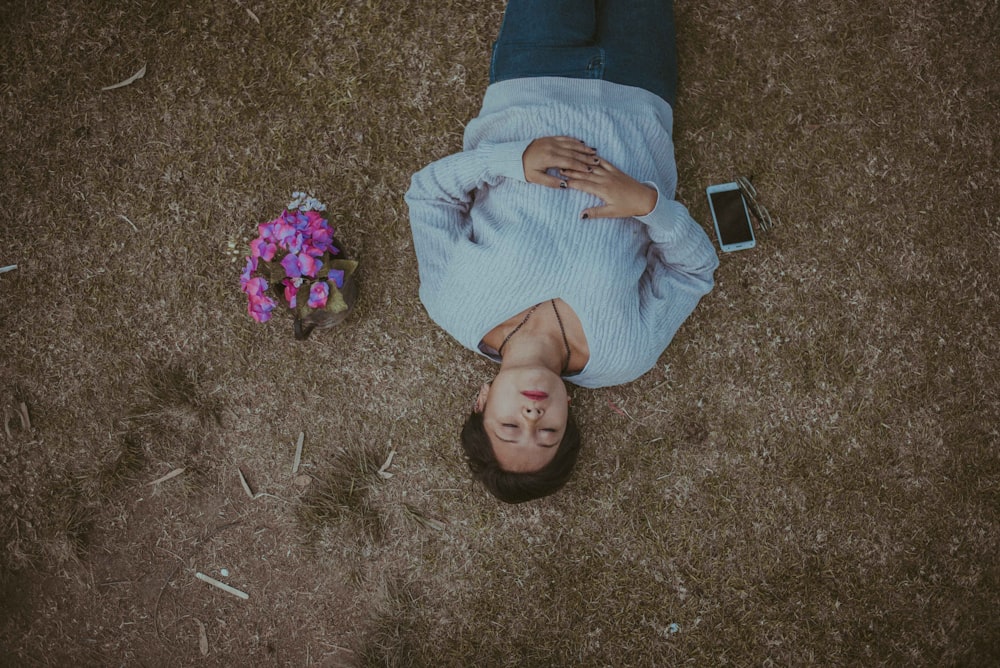 woman lying on grass