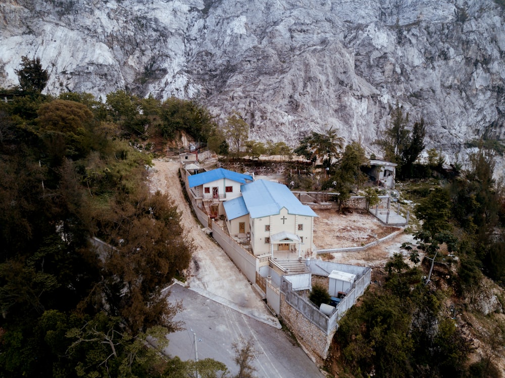 aerial view of church near rock cliff