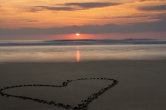 A breathtaking sunset over a romantic beach, symbolizing love.