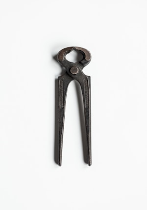 A pair of metal pliers with a simple, utilitarian design, set against a plain white background.