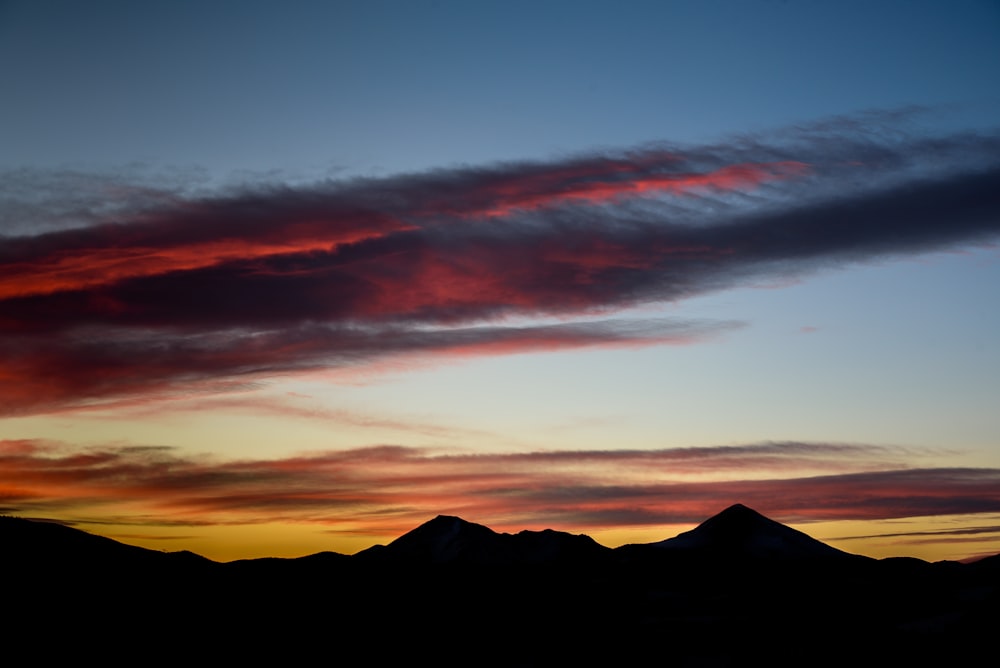 mountains under cloudy sky