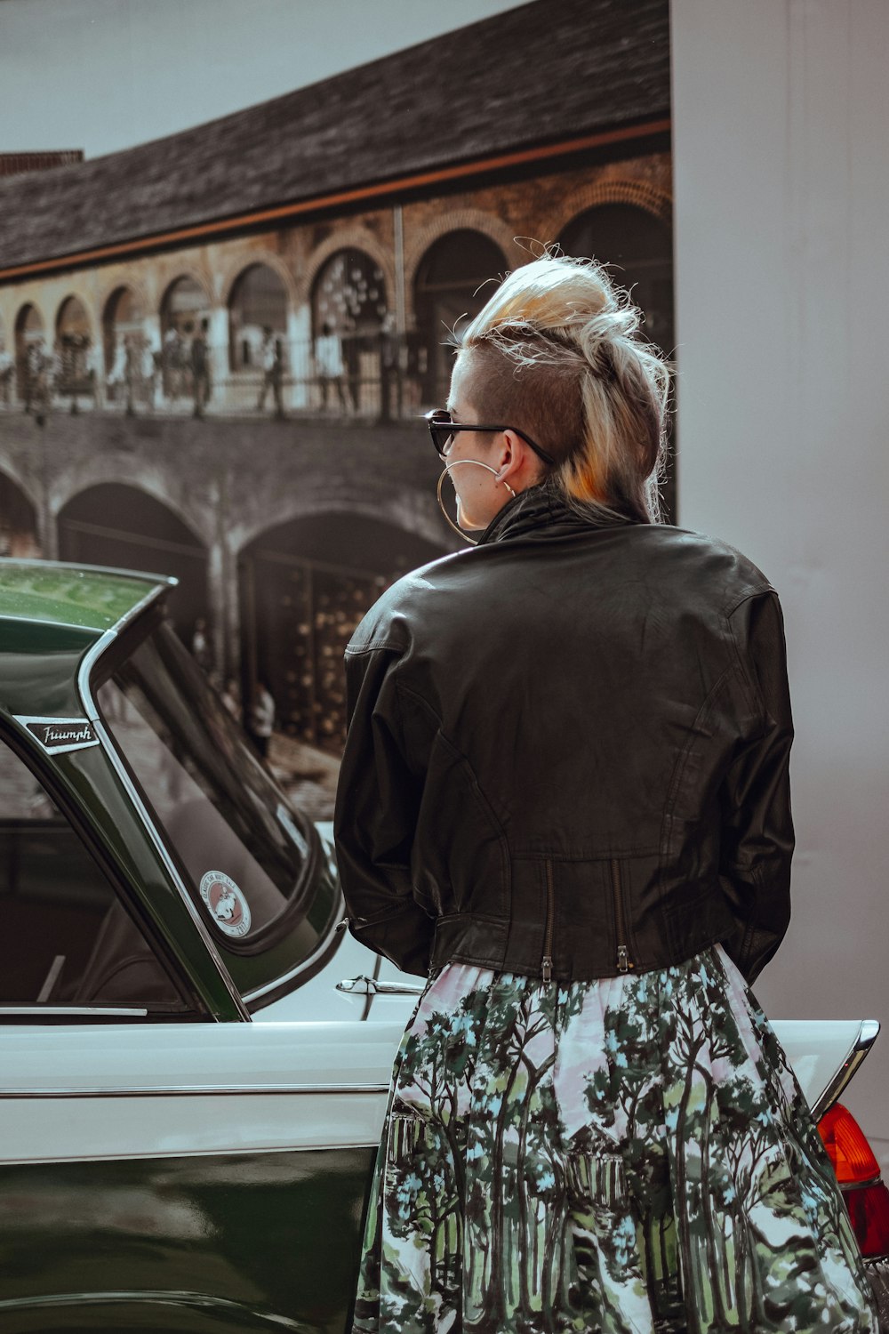 woman standing beside vehicle