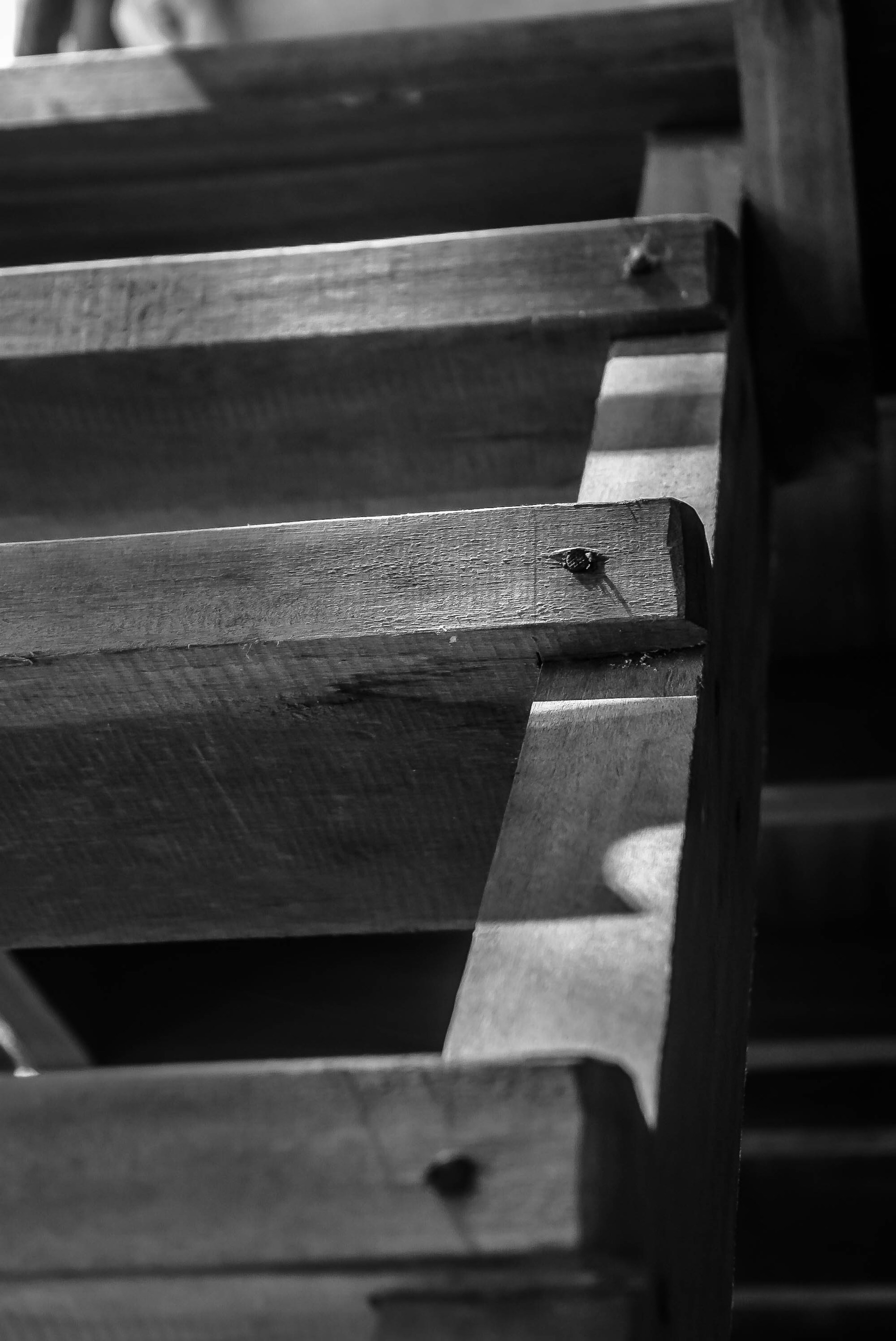 Close-up of a finely detailed hardwood staircase with clean, precise lines that reflect tysick contracting’s commitment to lasting quality.