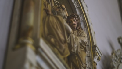 Close-up of a finely detailed 3D printed Catholic sacred art statue with hand-painted finish