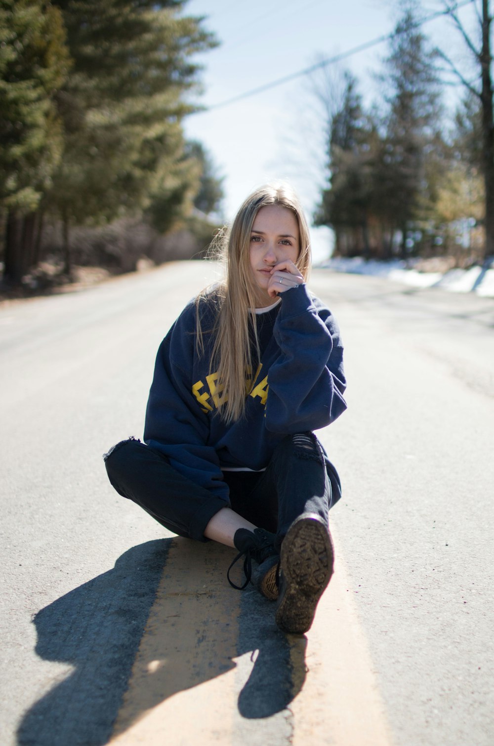 shallow focus photo of woman in black long-sleeved shirt