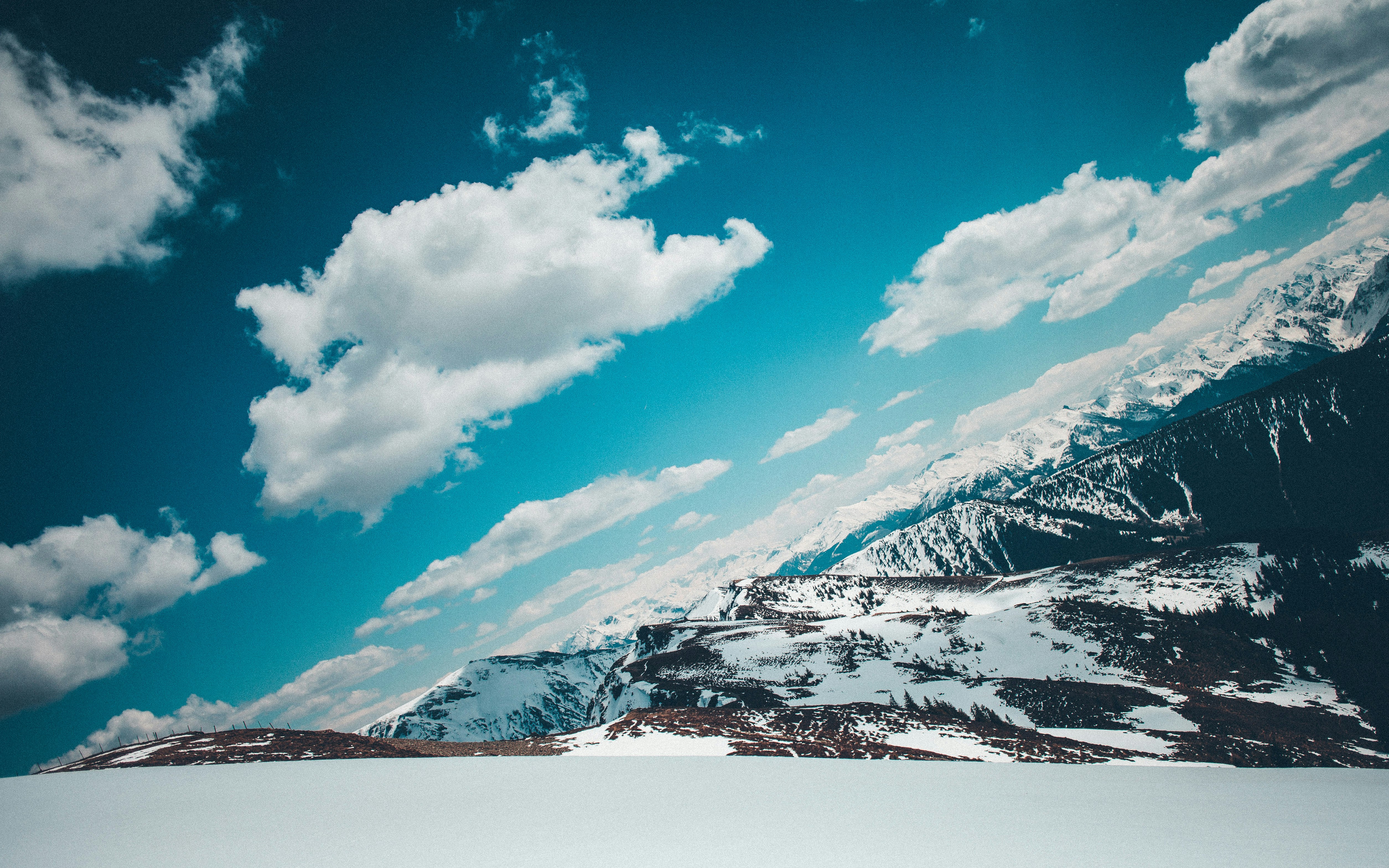 aerial photography of snow filled mountains