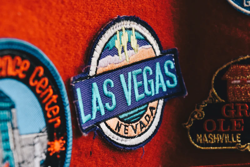 Detailed embroidered souvenir patch with lettering and pictorial artwork