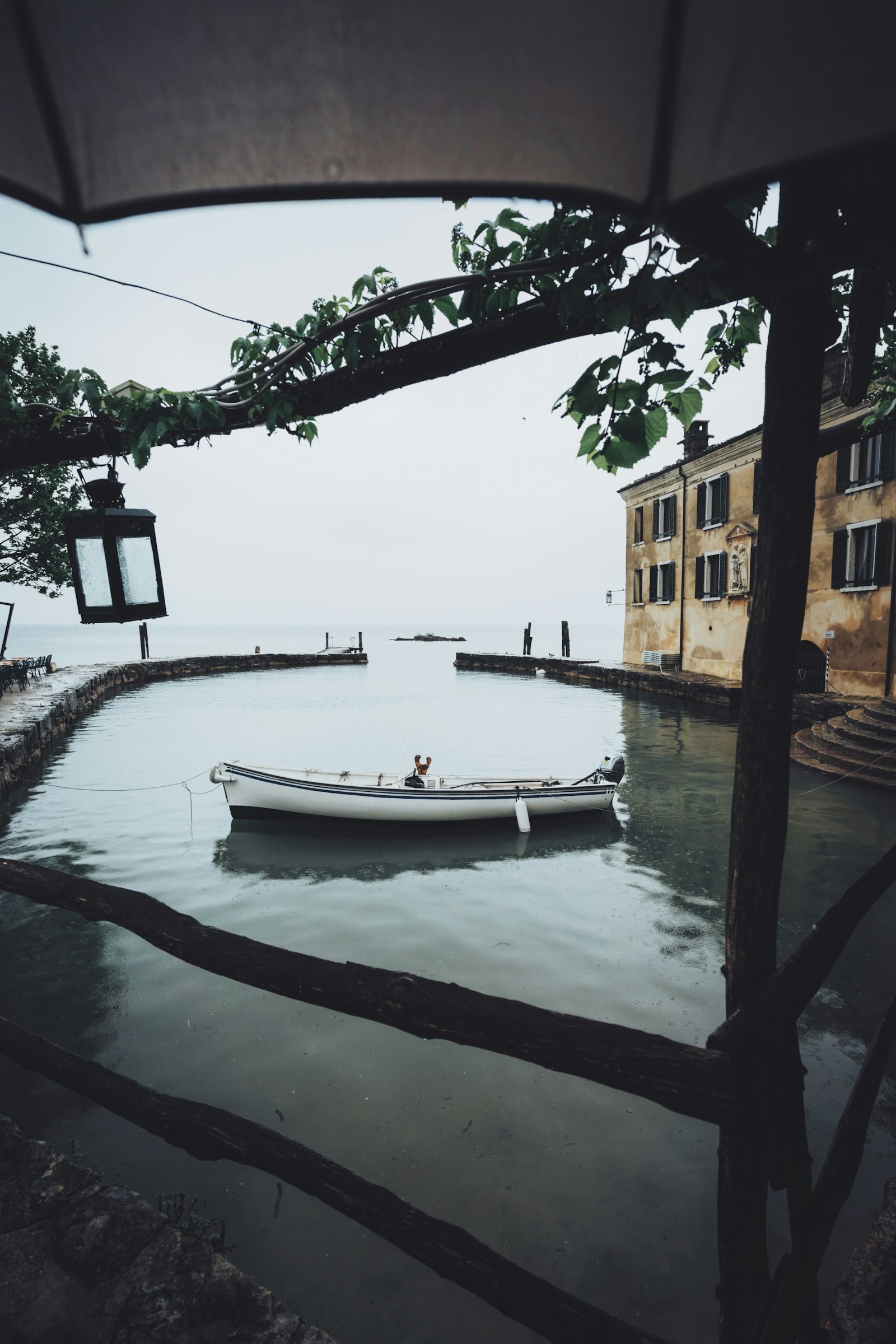 Sony a7 + Sony Vario-Tessar T* FE 16-35mm F4 ZA OSS sample photo. Canoe near dock photography