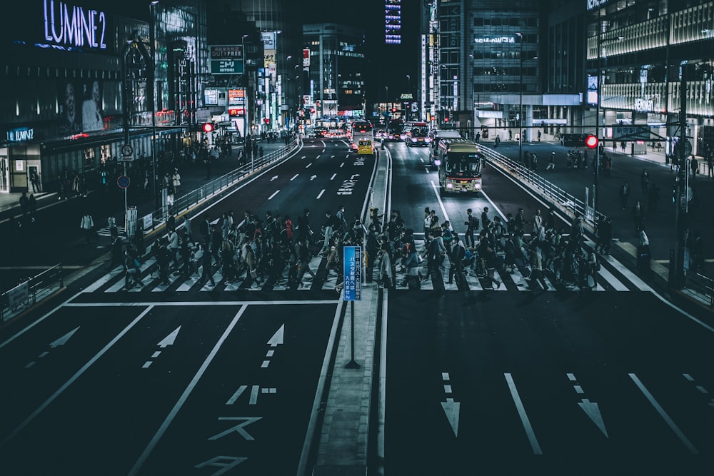 photo of pedestrian during nighttime