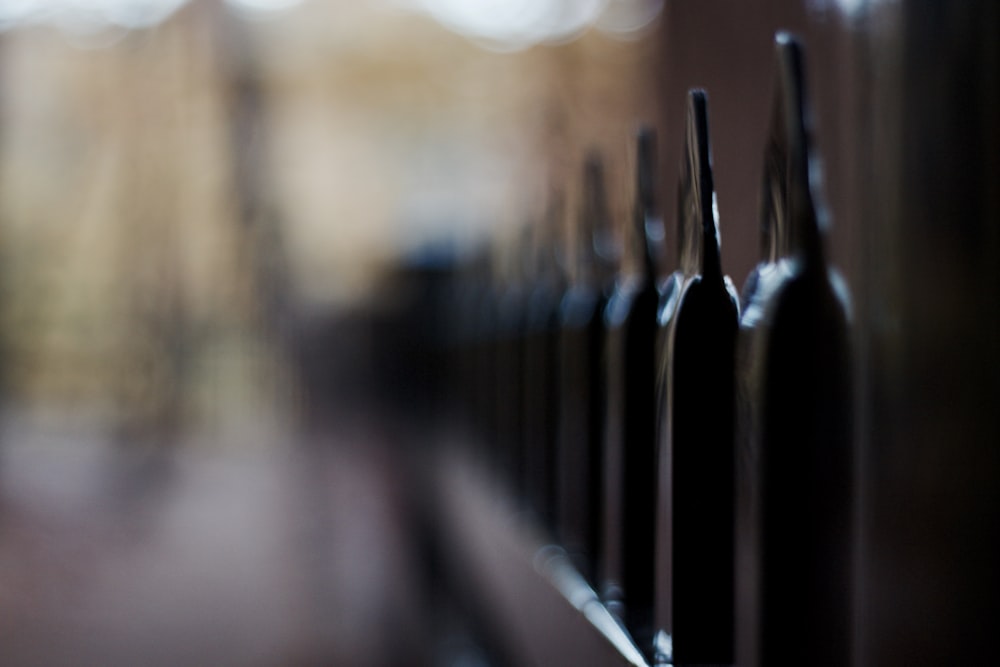 black metal fence in close up photography