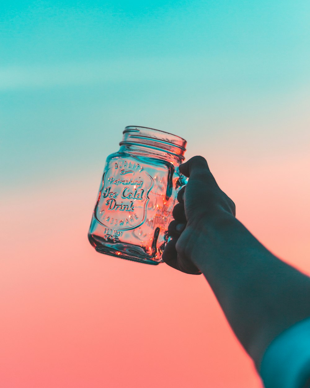 closeup photo of person's holding jar