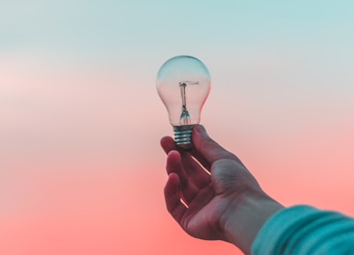 person holding light bulb