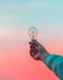 person holding light bulb