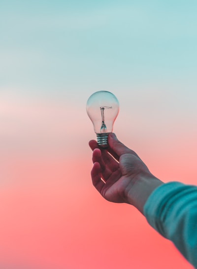 person holding light bulb