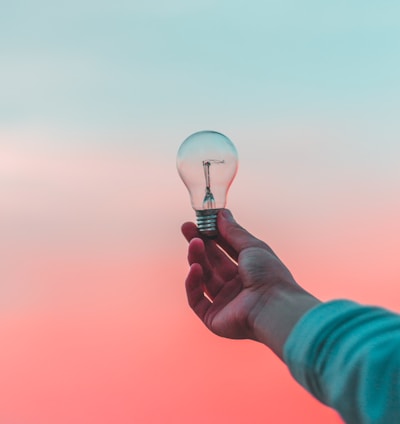 person holding light bulb