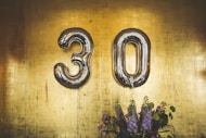 minimalist photography of hanged 30 balloons