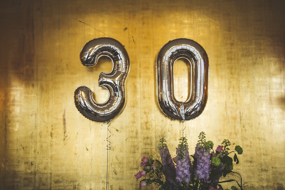 minimalist photography of hanged 30 balloons