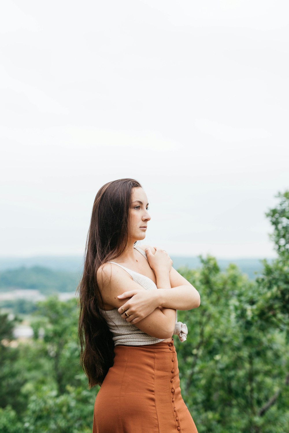 woman standing and facing her right side