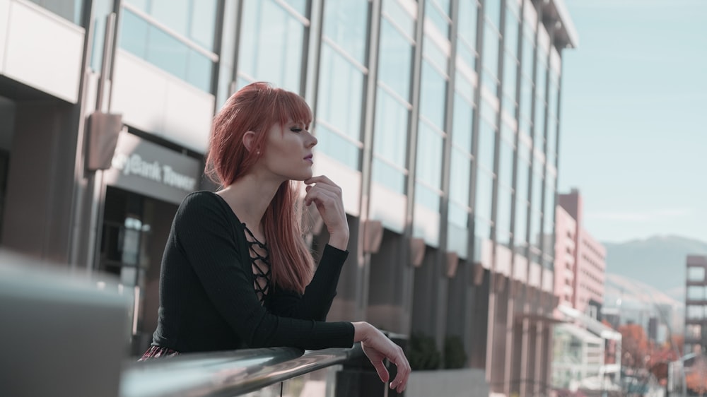 woman wearing black sweater while being photograph