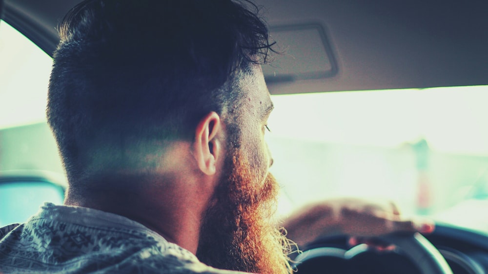 close up photography of man inside car