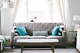 brown and white wooden table beside sofa chair