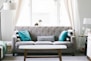 brown and white wooden table beside sofa chair