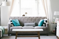 brown and white wooden table beside sofa chair