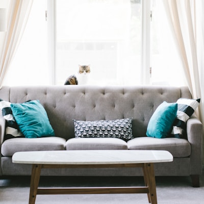 brown and white wooden table beside sofa chair