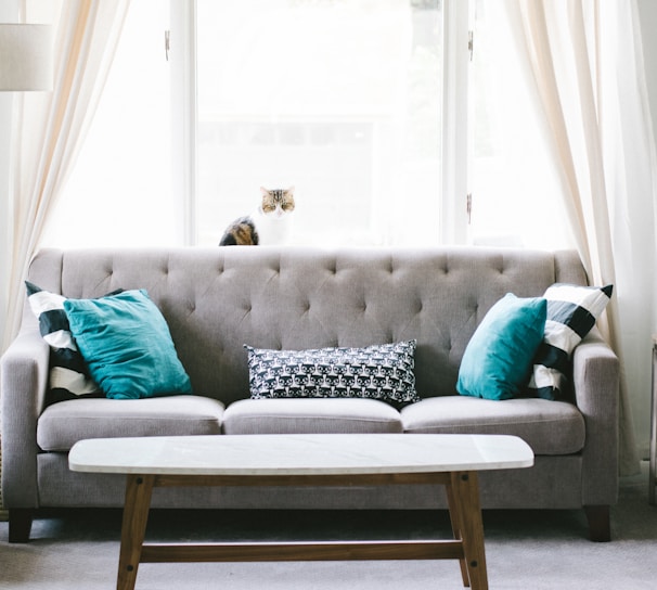 brown and white wooden table beside sofa chair