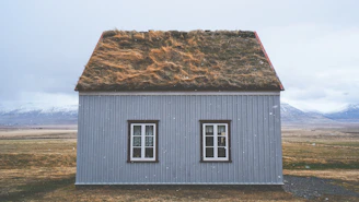 brown and gray house under blue sky