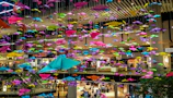 Image showing a team distributing colorful flyers to shoppers in a busy mall