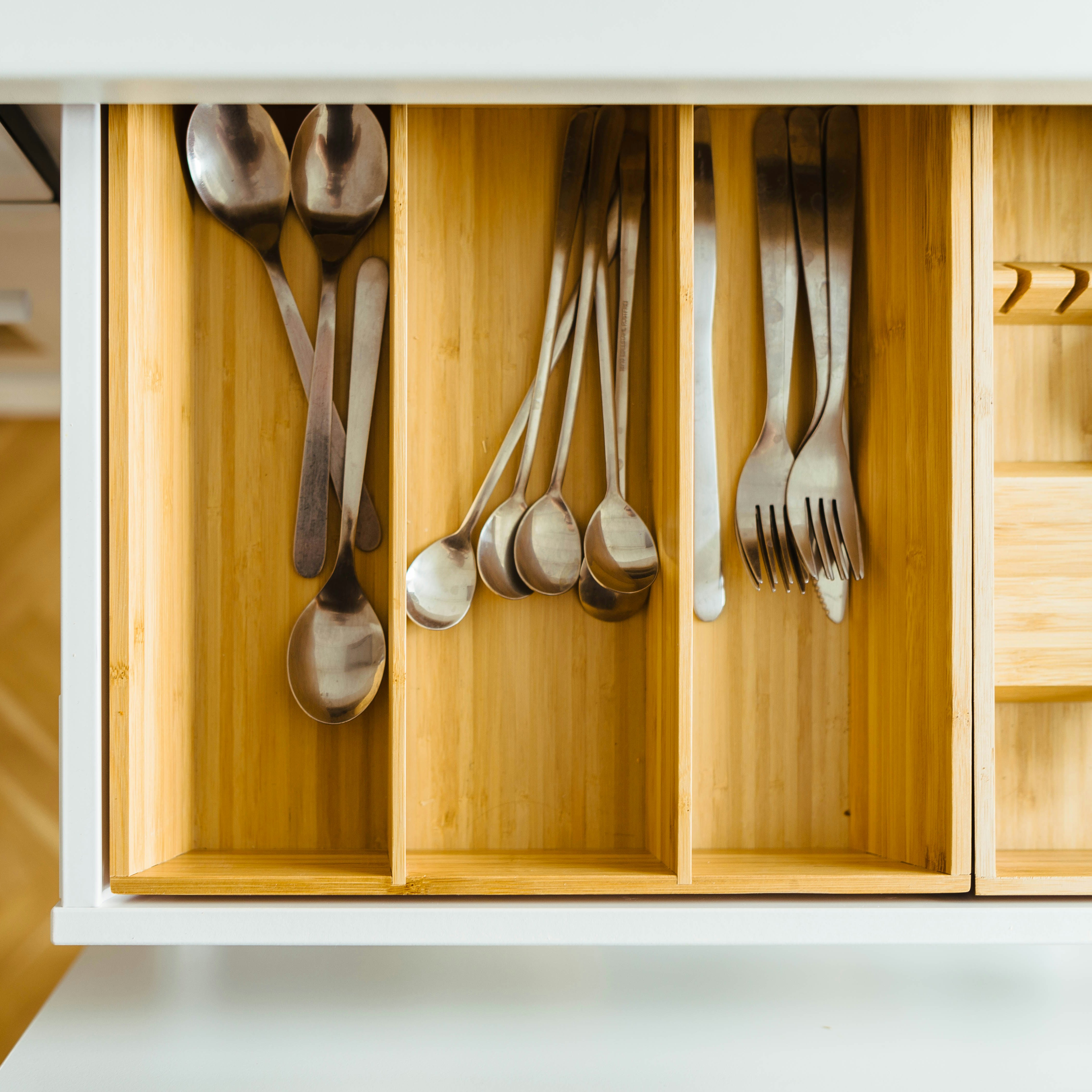 silver utensils in drawer