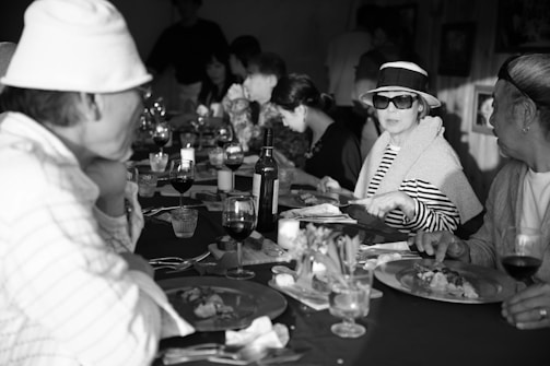 Friends enjoying a meal together around a beautifully set table.