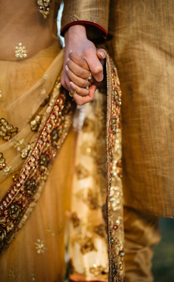 selective focus of two person holding hands