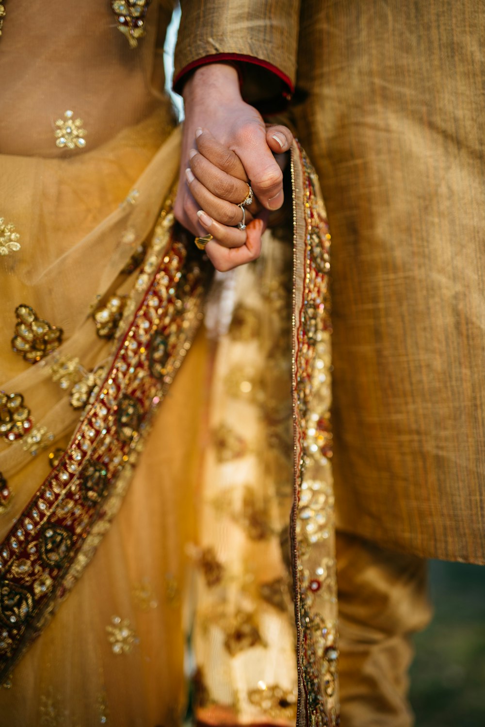 selective focus of two person holding hands