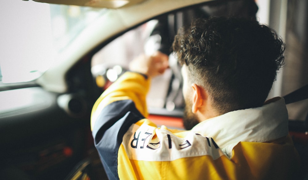 A male driver is making payment at the toll booth in Dresden.