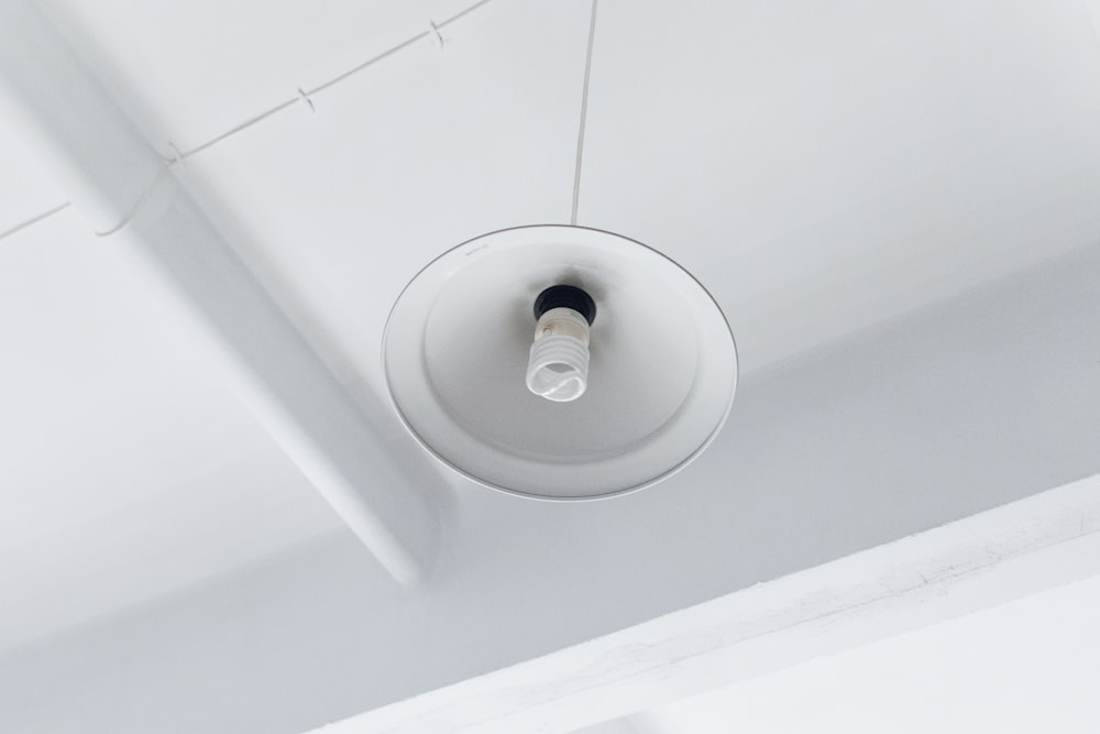 photo of white light bulb on ceiling