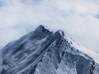 white fogs on mountain filled with snow
