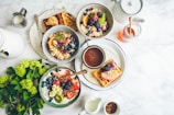 An inviting breakfast spread featuring oatmeal, fresh berries, and a cup of herbal tea.