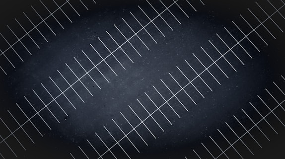 A drone view at night of parking lot lines