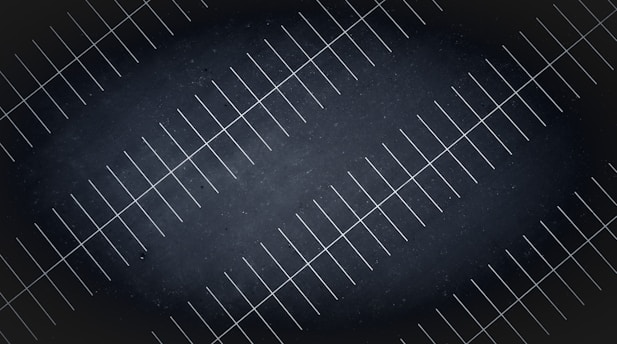A drone view at night of parking lot lines