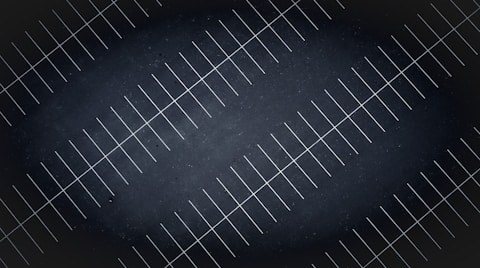 A drone view at night of parking lot lines