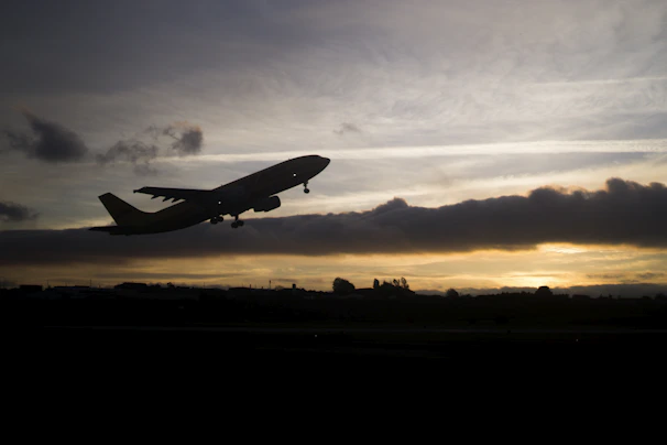 Cinematic shot of a sleek private jet preparing for takeoff against a twilight sky.