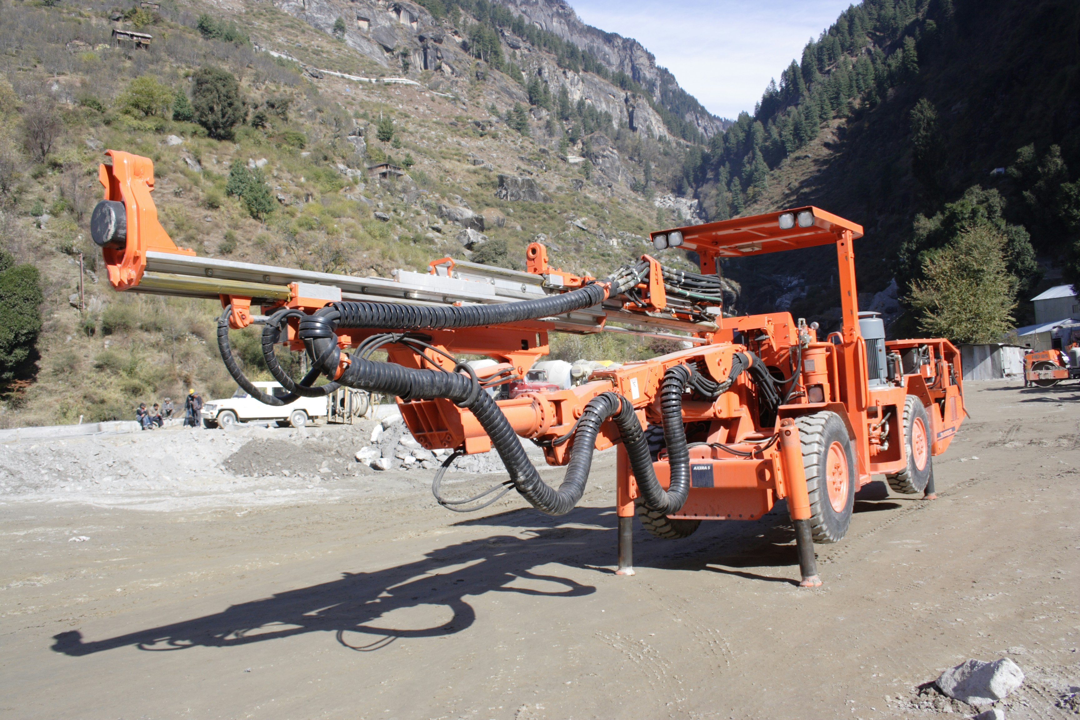 Efficient pneumatic air drill bit at work on a rocky surface