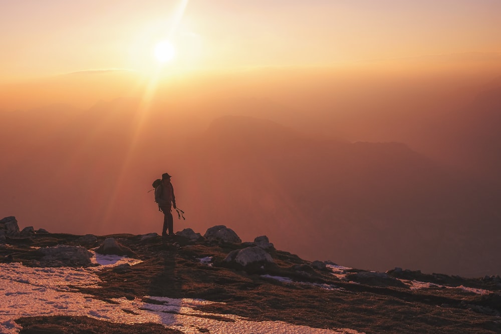 man hiking during daytime