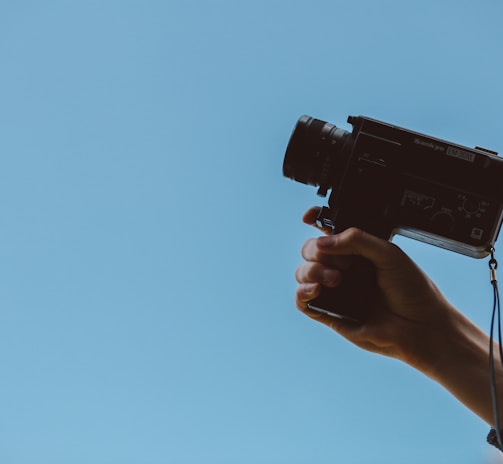 person holding video camera