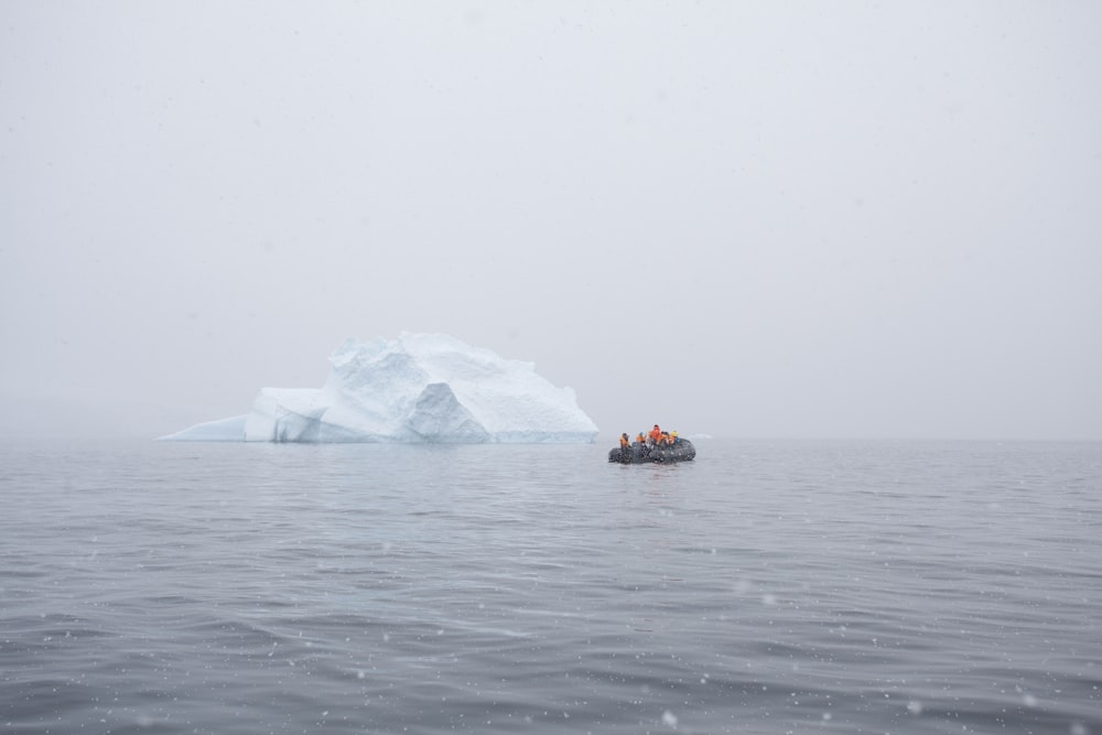 inflatable boat near iceberg