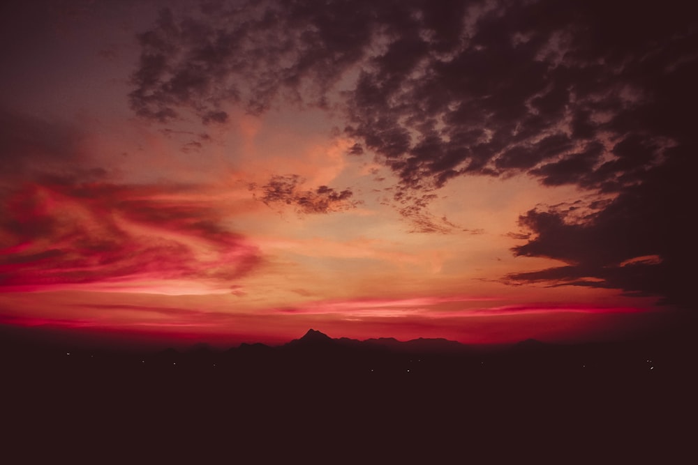 silhouette of mountains during sunset